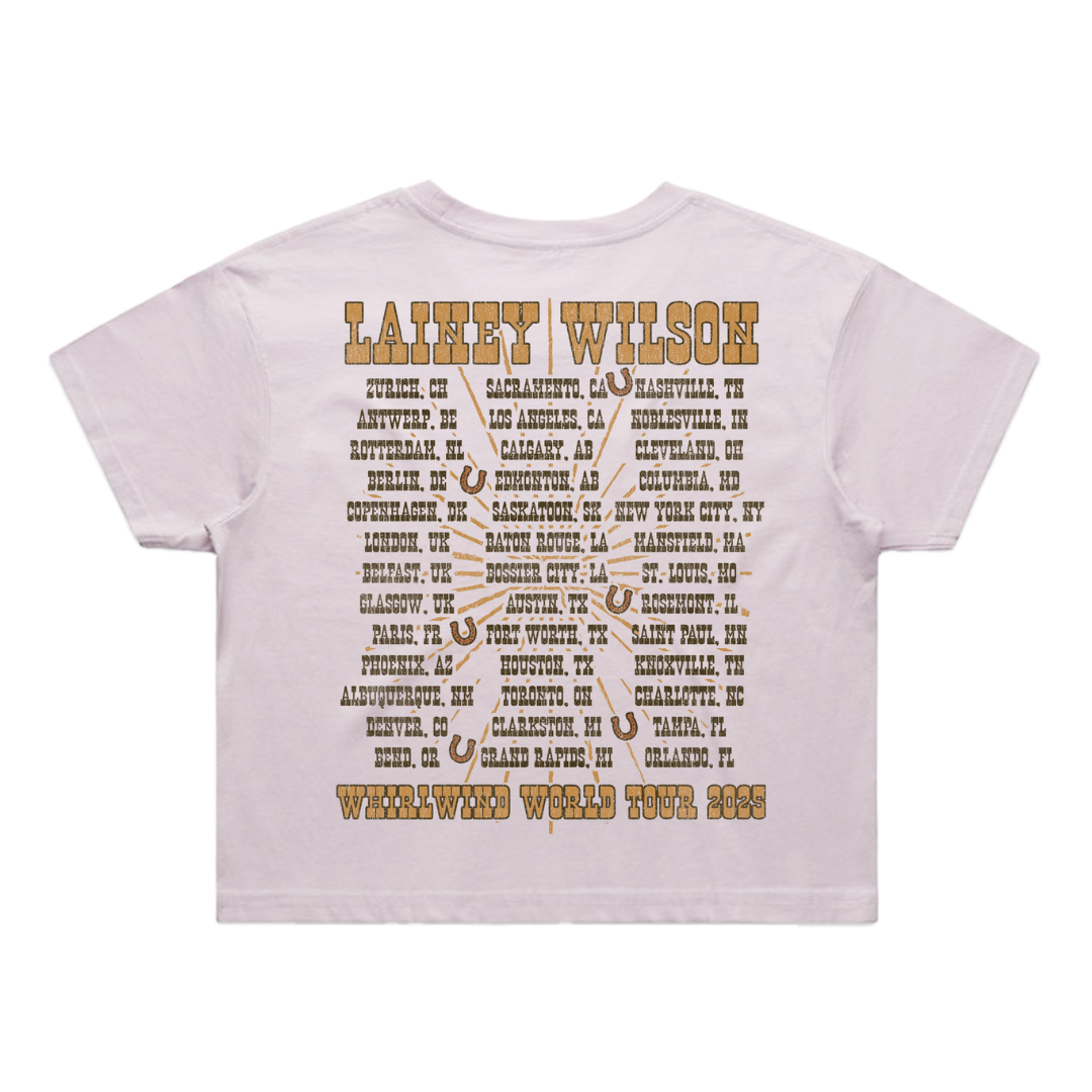 White t-shirt with brown text and horseshoe designs listing lainey wilson’s 2025 whirlwind world tour cities