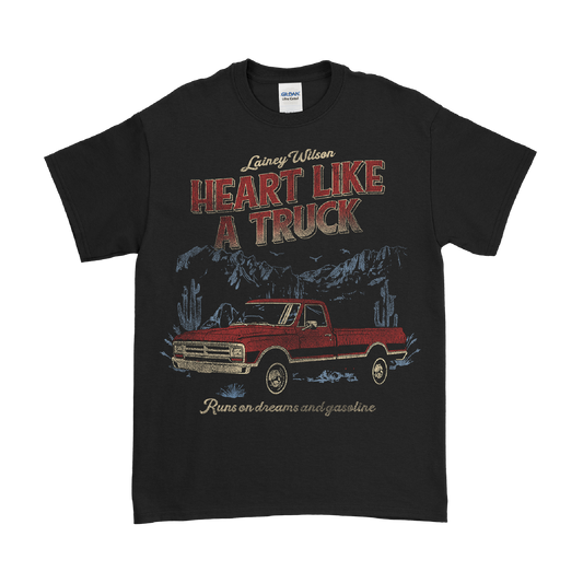 Black t-shirt featuring a vintage-style graphic of a red pickup truck and text reading ’Heart Like A Truck’.