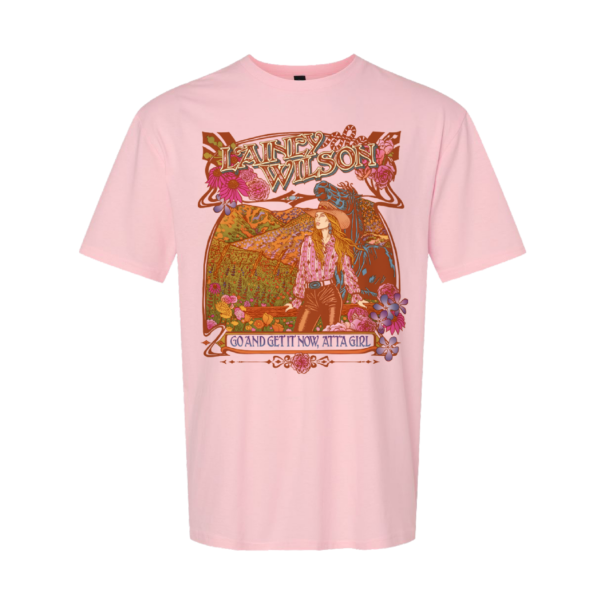 A soft pink cotton t-shirt featuring a vibrant, ornate graphic of lainey wilson with floral and mountain scenery in earthy tones.