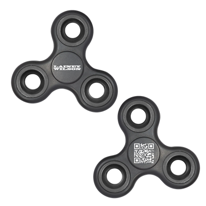 Black plastic fidget spinners, one featuring the ’lainey wilson’ logo and the other displaying a qr code.