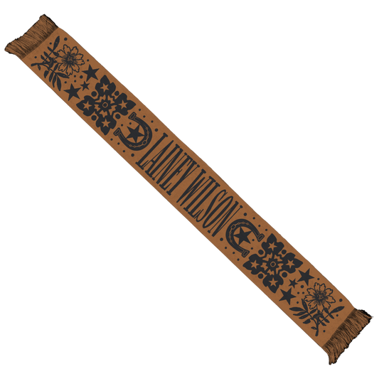 Tan scarf with black floral and star patterns, featuring the text ’laney wilson’ in a bold font.