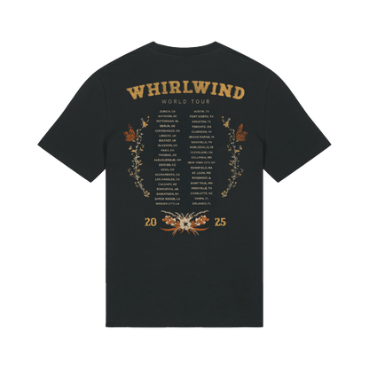 Dark gray t-shirt featuring a gold-embossed ’whirlwind world tour’ design with city names and floral motifs.
