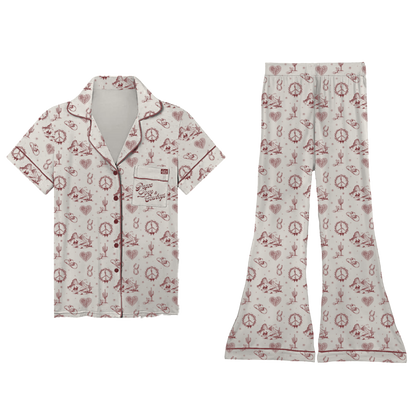 Cream-colored cowboys pyjama set with red and white peace signs hearts cacti and cowboy hats pattern inspired by lainey wilson