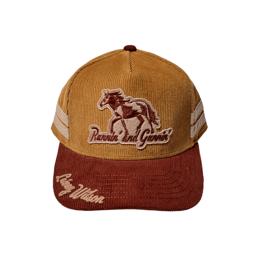 Tan corduroy baseball cap with brown horse patch and runnin and goin embroidery from official lainey wilson uk merch