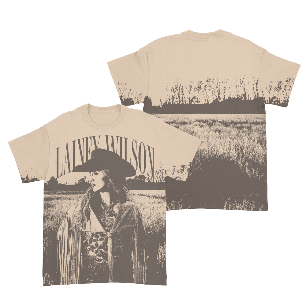 Cream-colored cotton t-shirt featuring a sepia-toned graphic of lainey wilson in a field, with her name arched above the image.
