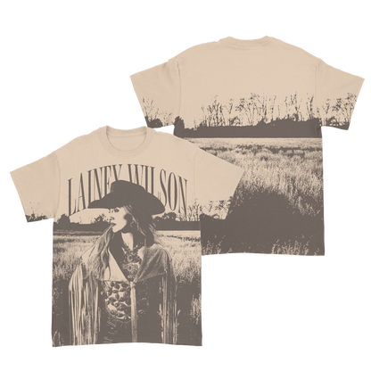 Cream-colored cotton t-shirt featuring a sepia-toned graphic of lainey wilson in a field, with her name arched above the image.