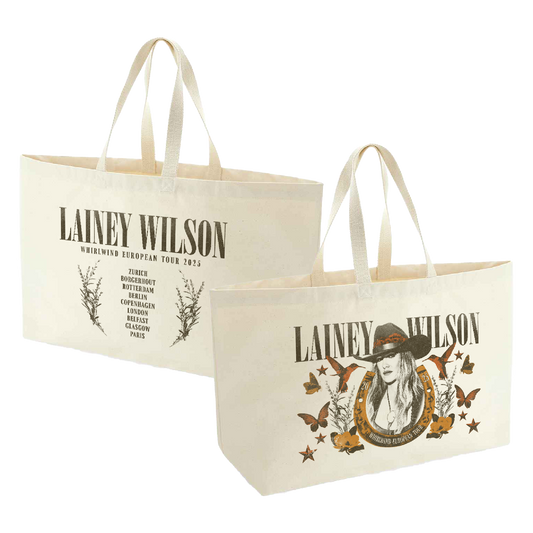 Cream-colored canvas tote bags featuring lainey wilson’s ’whirlwind european tour 2023’’ branding with a graphic of her in a hat surrounded by butterflies and stars.